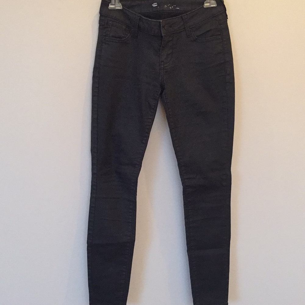 Waxed low rise black skinny jeans